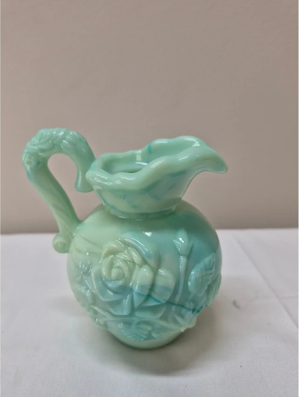 Vintage Avon Light Green Milk Glass Pitcher with Raised Floral Design J36
